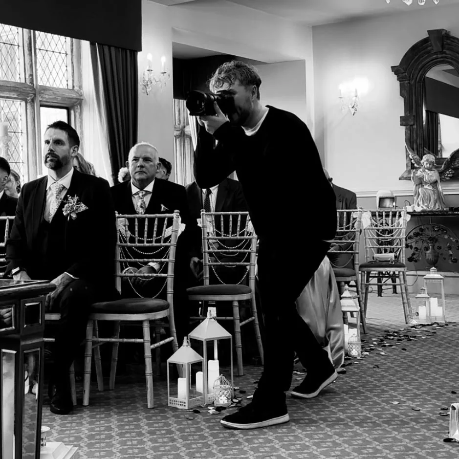 Rob photographing a ceremony from the aisle