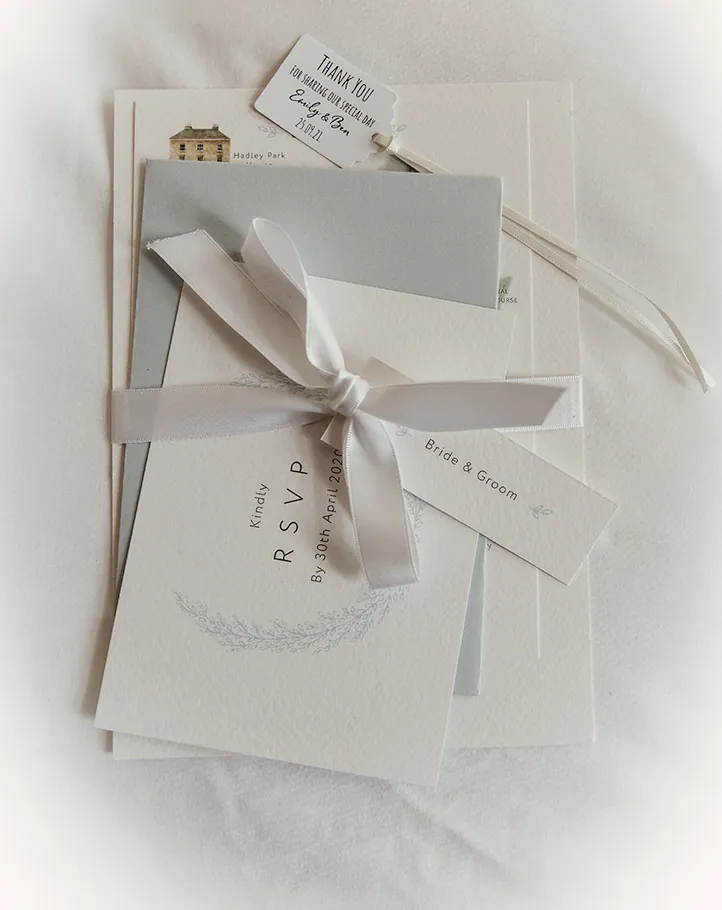 Wedding invitation tied with ribbon
