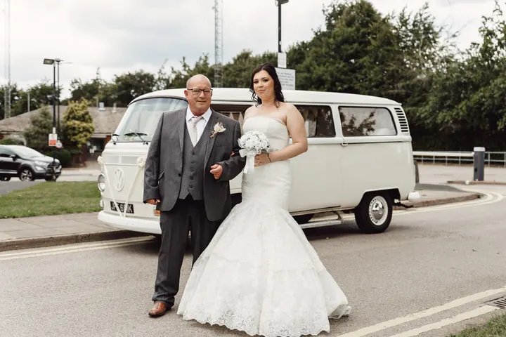 Laura walking from the camper van to the ceremony