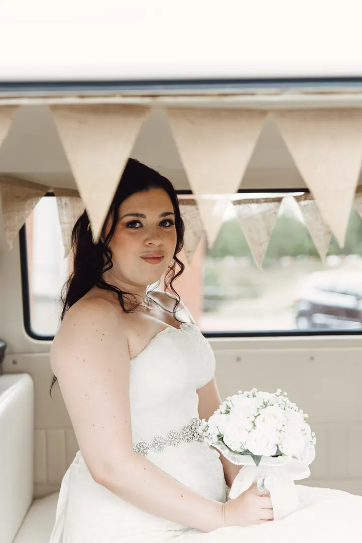 Laura beneath the bunting in the camper van