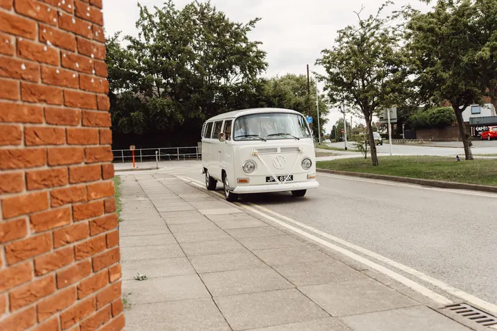 A cream vintage VW camper van arriving at the Civic Centre