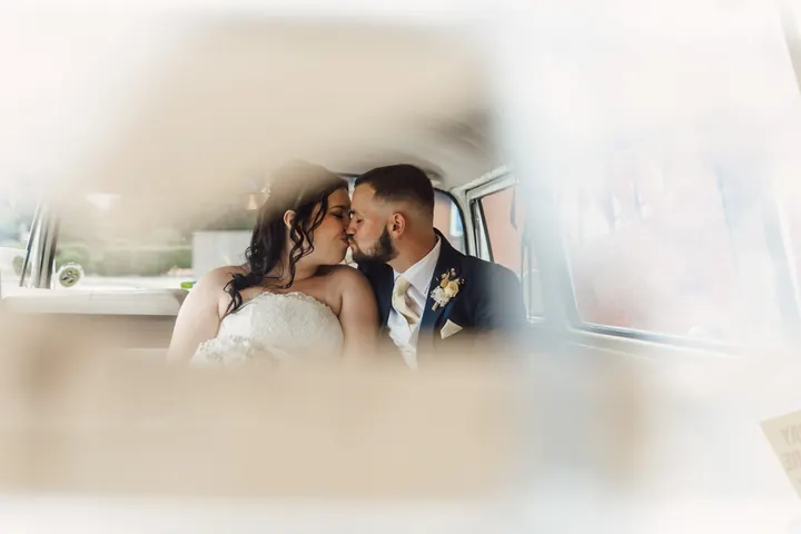 Laura and Owen seen through the camper window