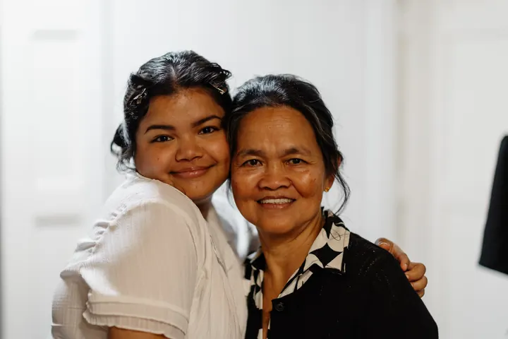 Gloria cheek to cheek with her mum