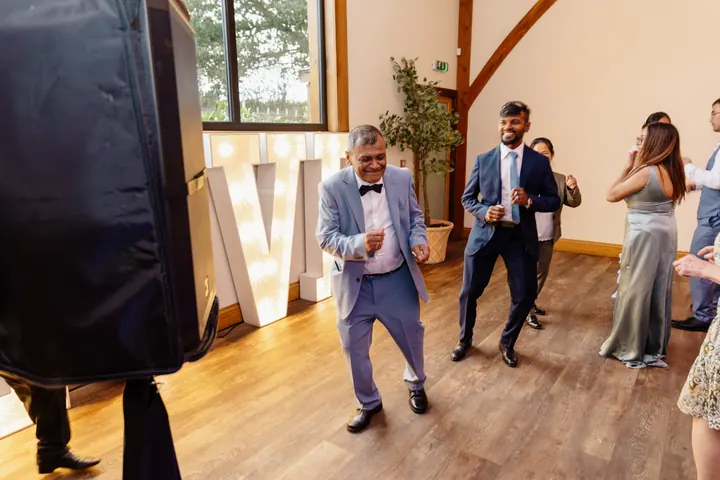 Gloria&rsquo;s dad dancing with guests