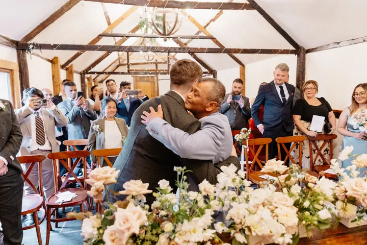 Gloria&rsquo;s dad giving Oliver a big hug at the front