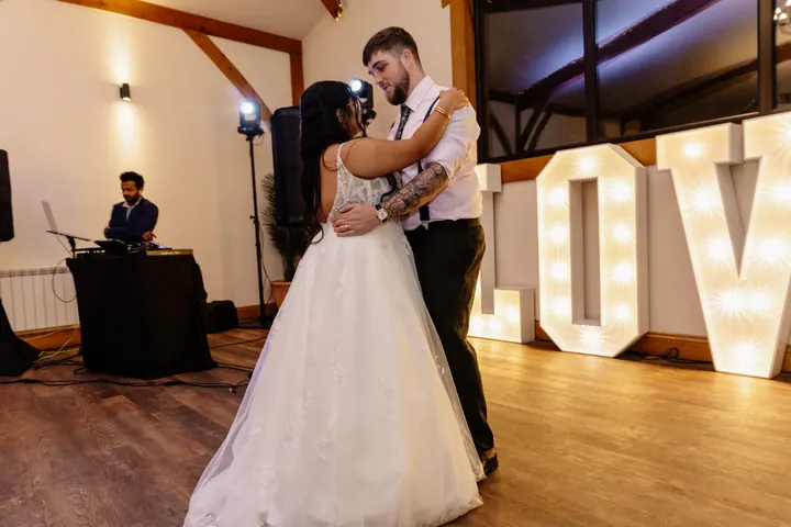The first dance in front of the giant LOVE letters