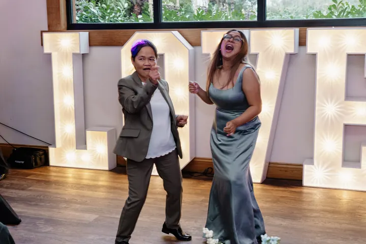 Gloria&rsquo;s mum dancing in front of the light-up LOVE letters