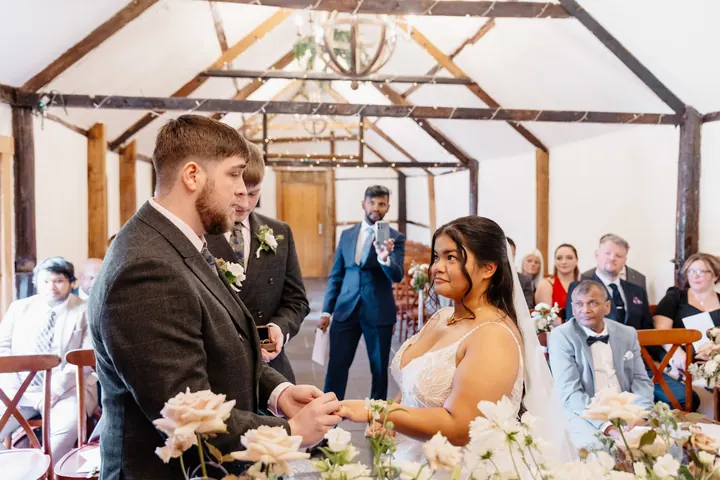 Oliver placing the ring on Gloria&rsquo;s finger