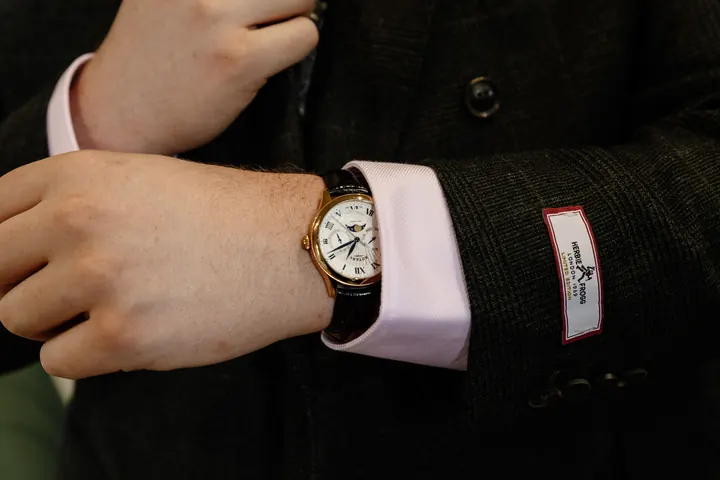 A watch and cufflink on Oliver&rsquo;s wrist