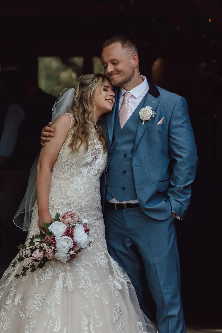 Natasha and Ryan in a dark barn doorway