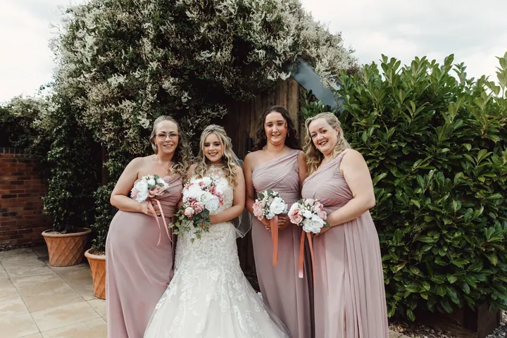 Natasha with her bridesmaids in blush pink