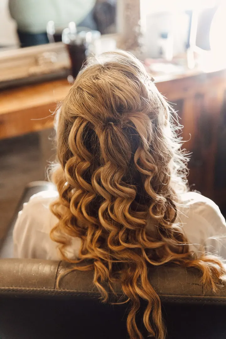 Natasha&rsquo;s long curled hair while getting ready