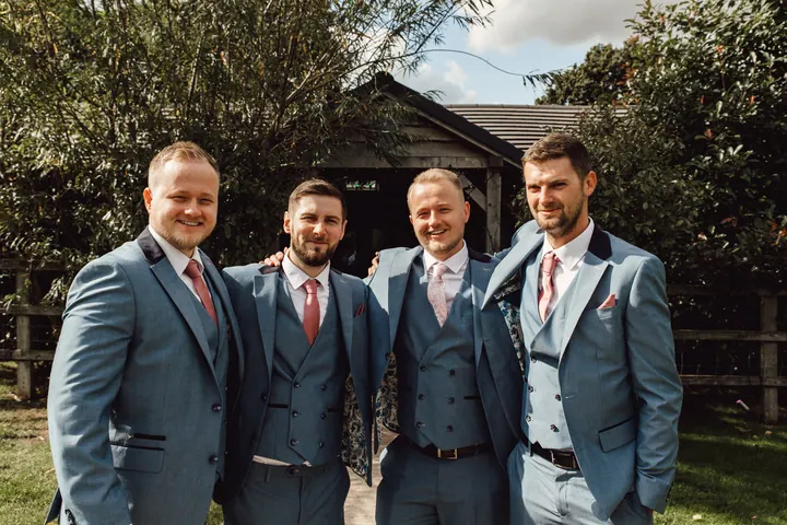 Ryan and his groomsmen in matching light blue suits