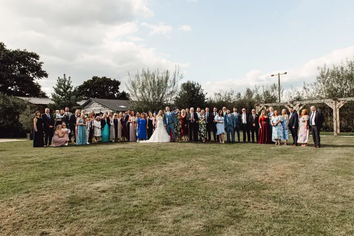 All the guests gathered on the lawn for a group photo