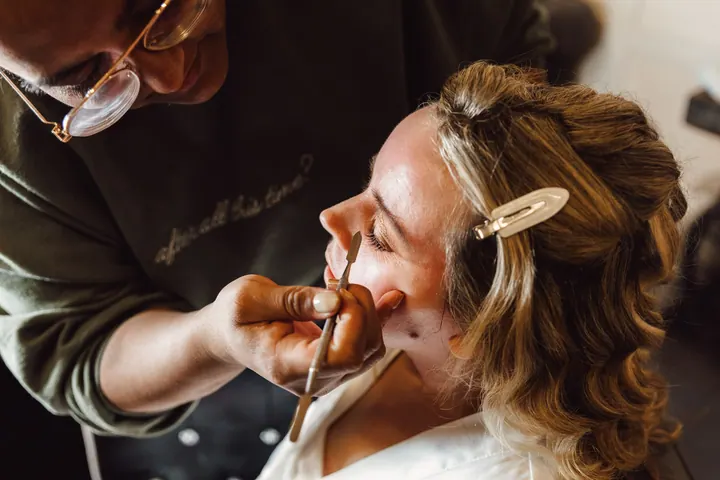 Natasha laughing as her make-up is done