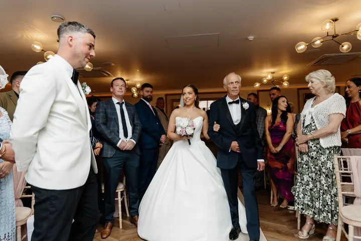 Hayley walking down the aisle on her dad&rsquo;s arm