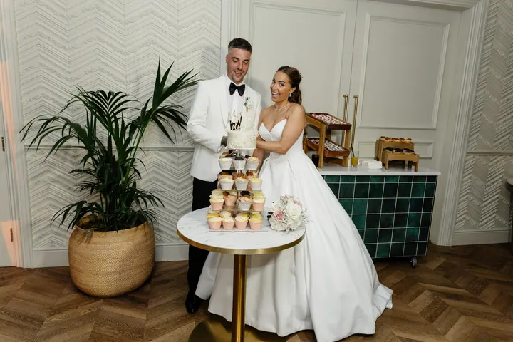 Hayley and Marco cutting the cake