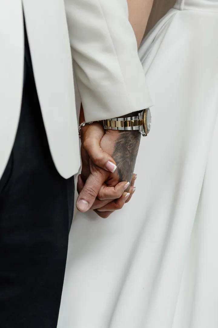 Hayley and Marco holding hands at the front