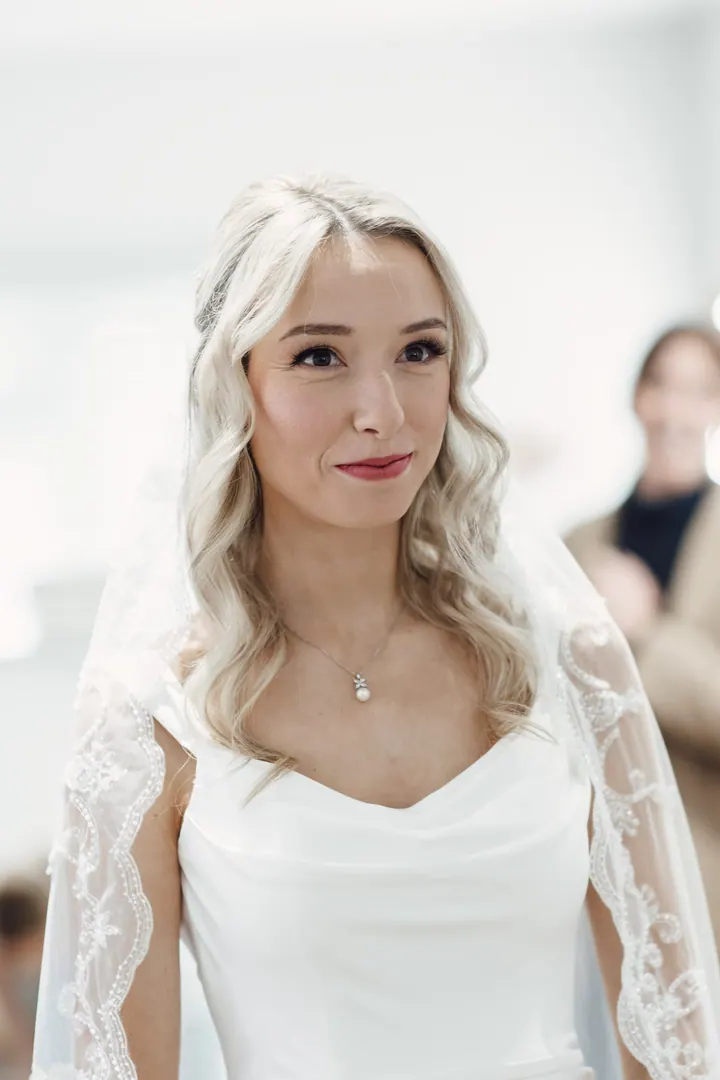 Cicely in her lace-edged veil, moments before leaving the bridal suite
