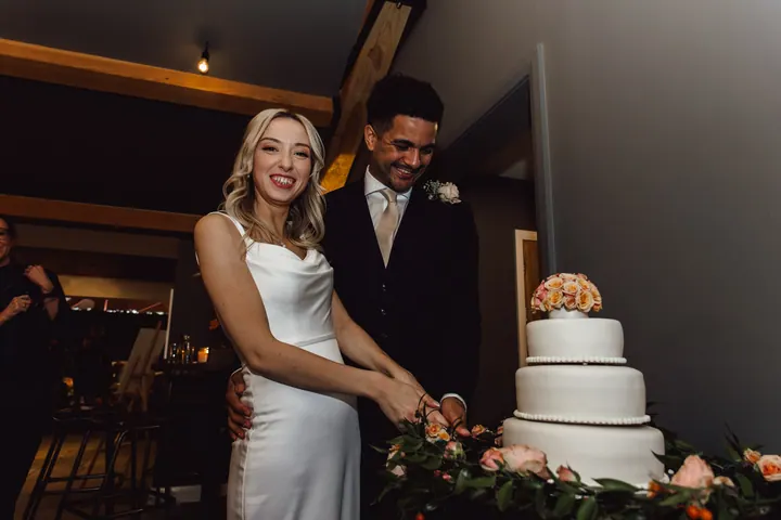 Cicely and Nathan cutting the cake