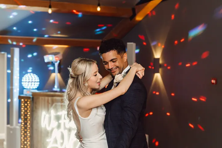 Cicely and Nathan laughing during their first dance