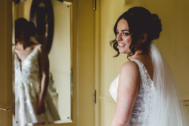 Hannah in her dress, reflected in a mirror