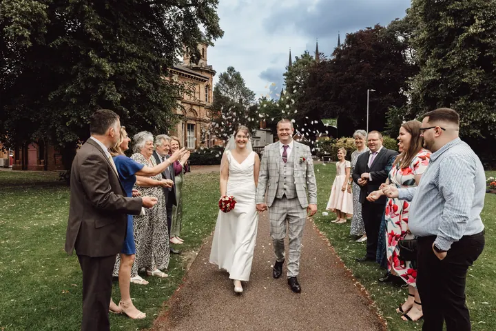 Guests lining the path with confetti