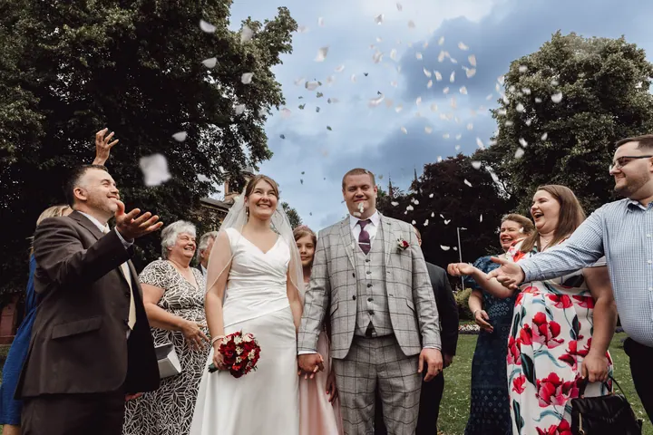 Confetti flying over Aleks and Jamie