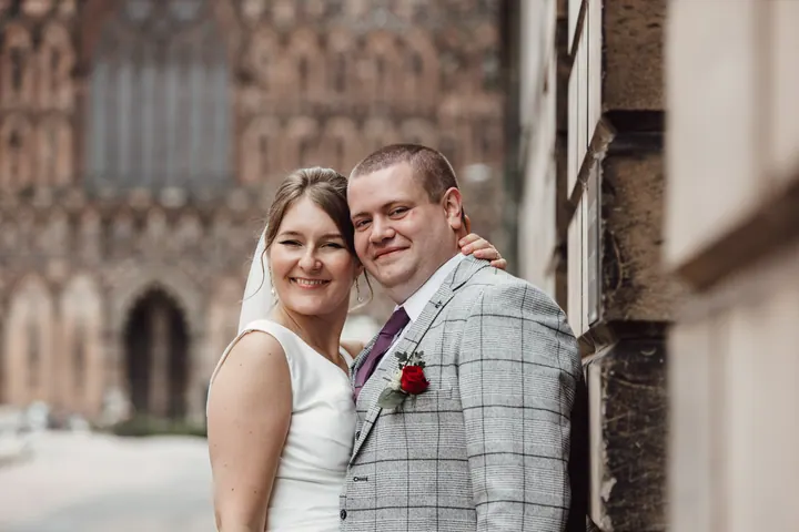 The couple in front of the carved west front of Lichfield Cathedral