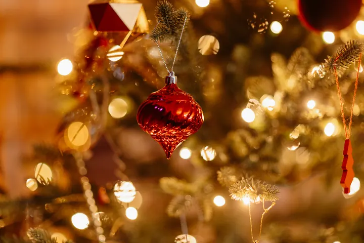 Red and gold baubles on the library Christmas tree