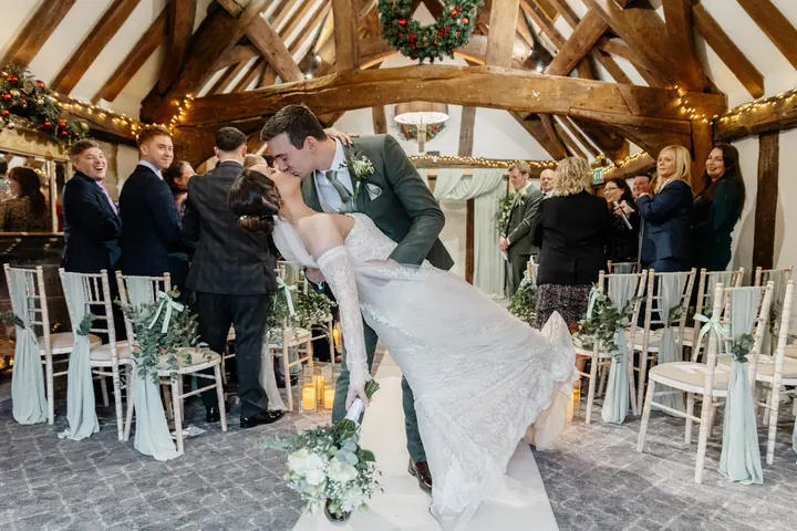 A dip and a kiss on the way back down the aisle