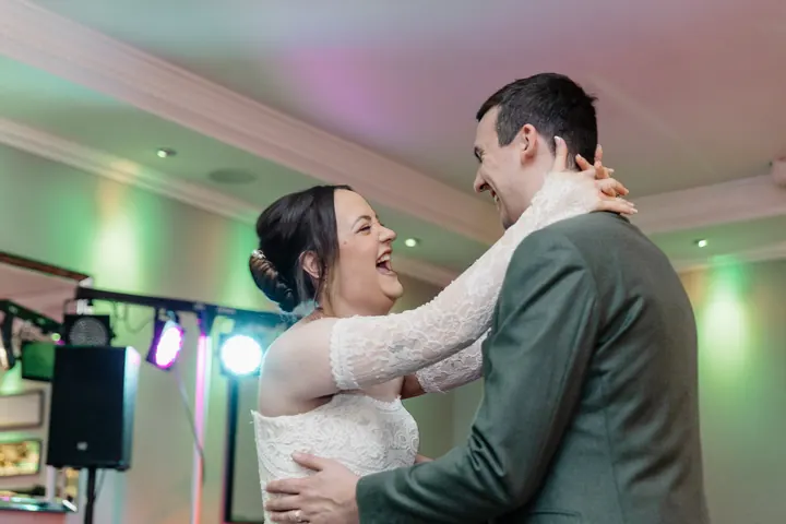 Sam laughing during the first dance