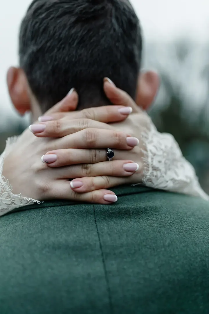 Sam&rsquo;s hands clasped behind Andrew&rsquo;s neck