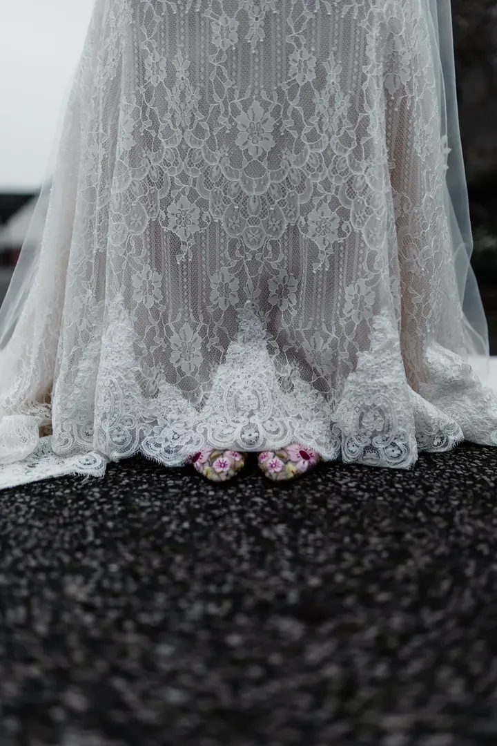 The lace hem of Sam&rsquo;s dress on the path