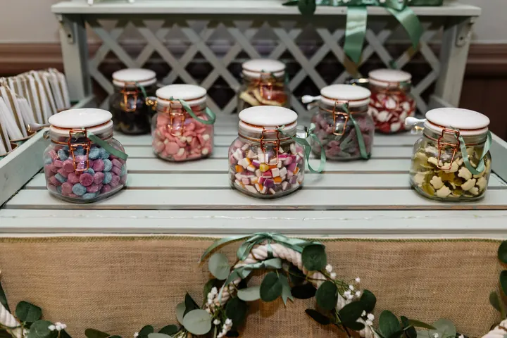 Sweet jars on a rustic sweet table