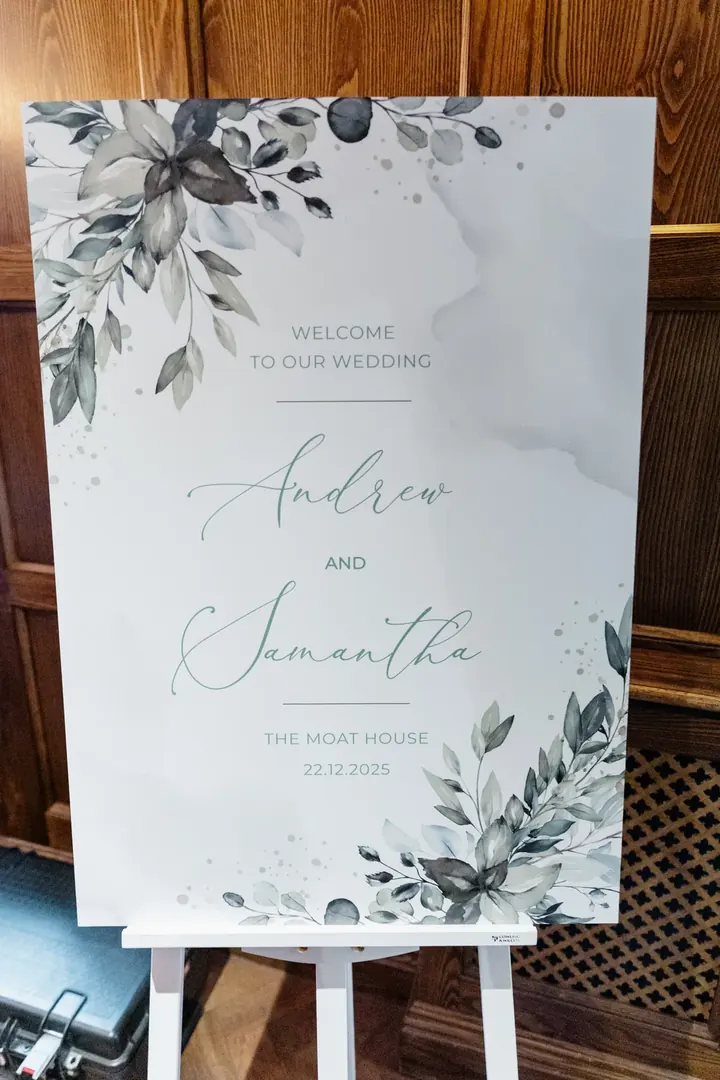 A eucalyptus welcome sign for Andrew and Samantha