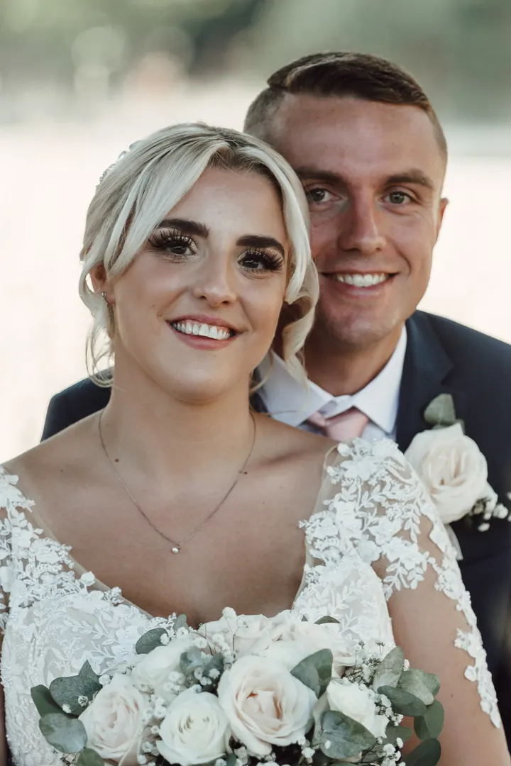 Sarah and Sam smiling close together