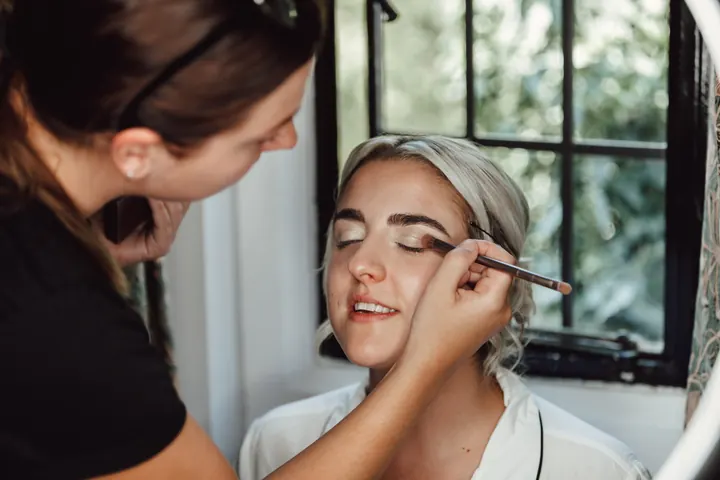 Finishing touches to Sarah&rsquo;s make-up by the leaded window