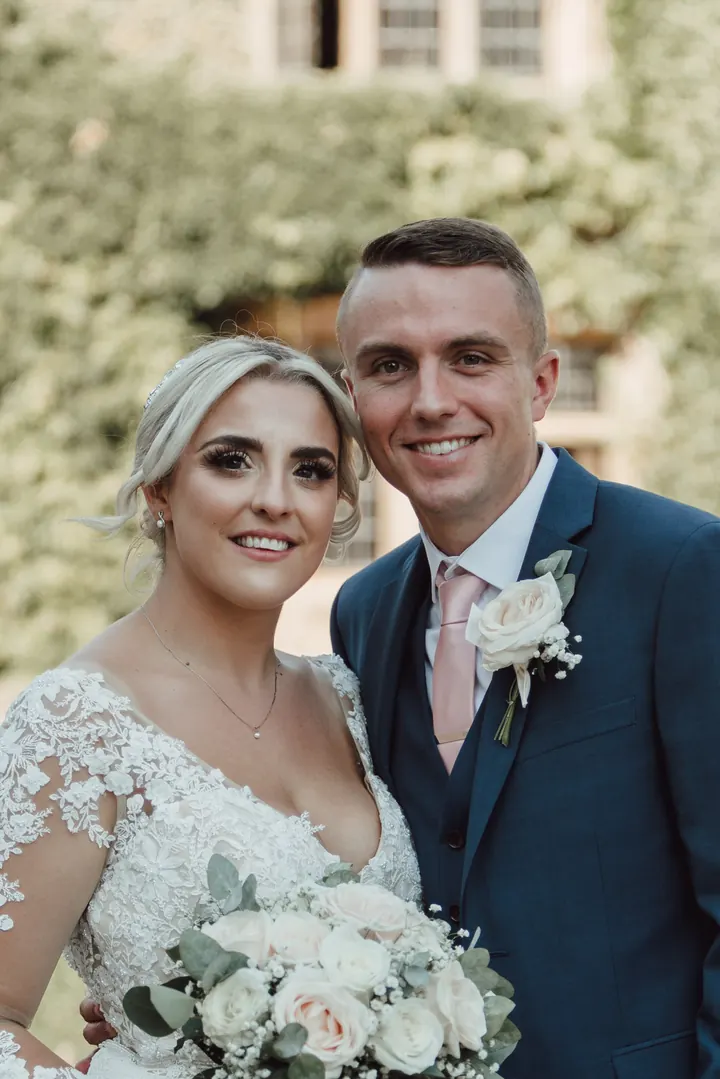 Sarah and Sam in front of the ivy-covered house at Quorn Grange Hotel