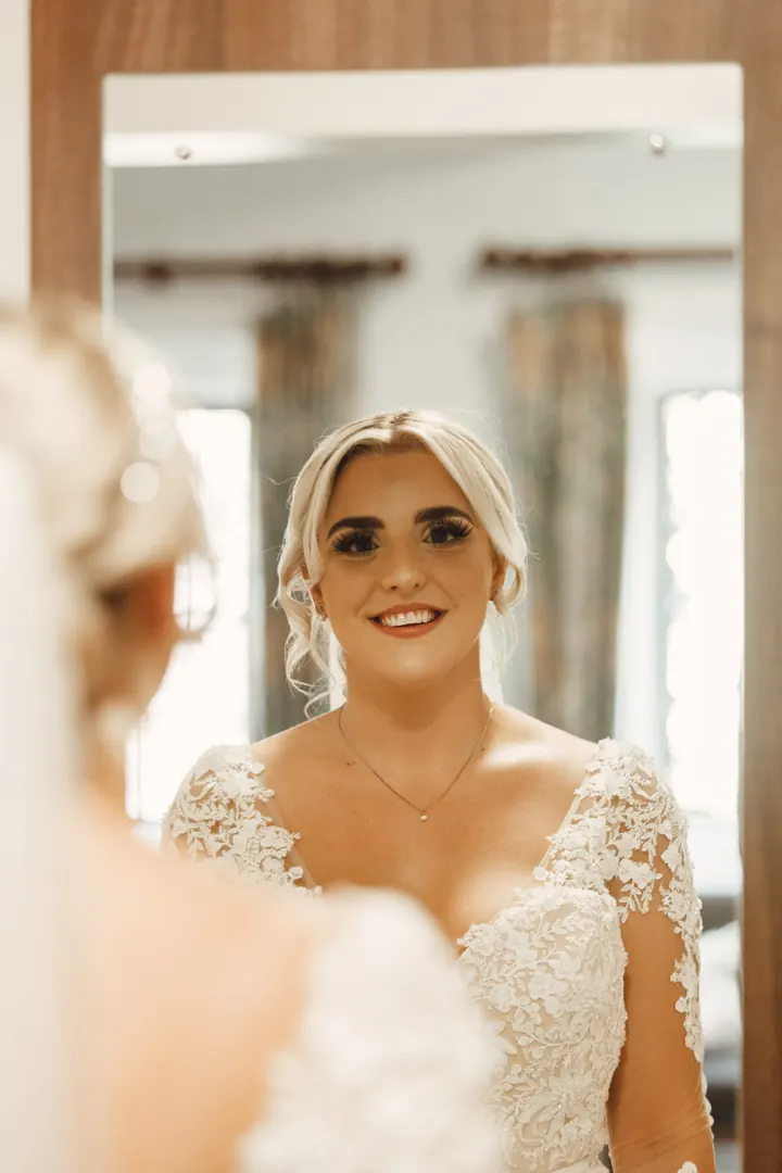 Sarah reflected in the mirror, ready to go