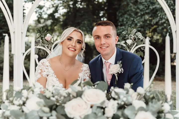 Sarah and Sam signing the register