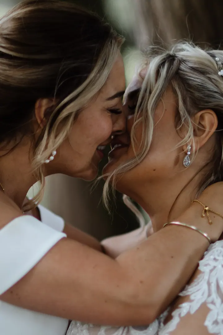 A close-up of the brides kissing