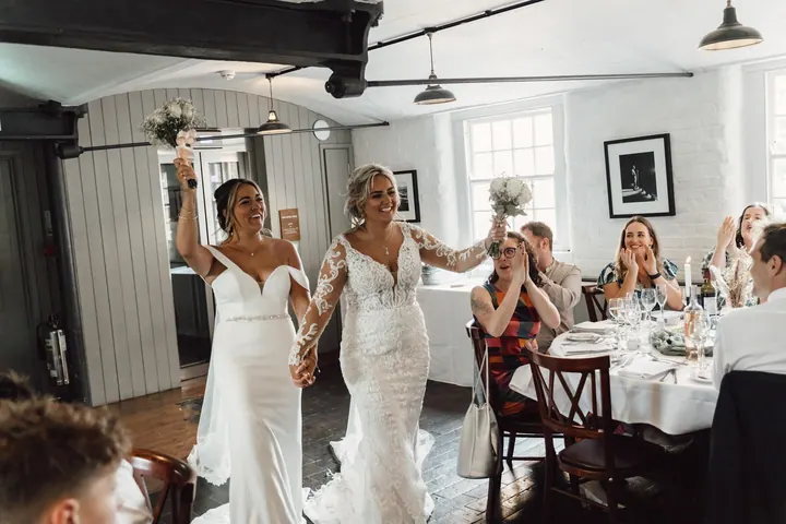 The brides dancing into the wedding breakfast to cheers