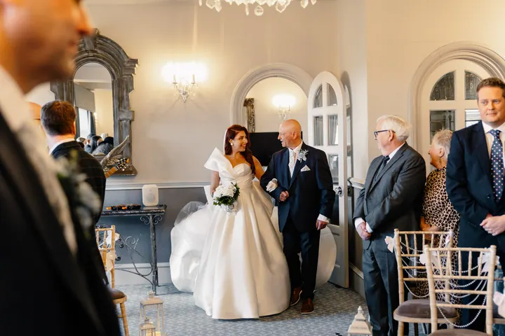 Laura being walked down the aisle